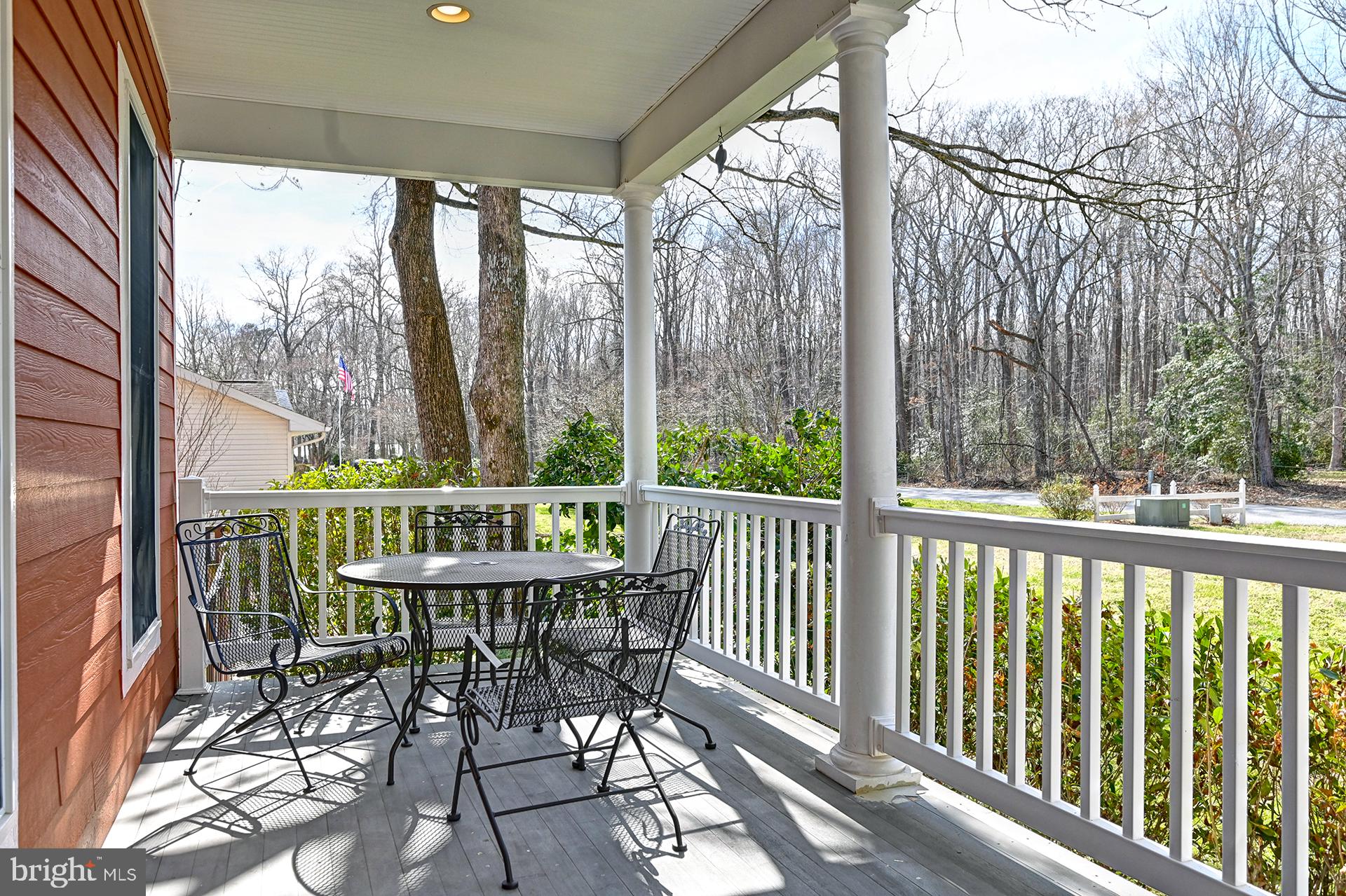 31765 Hickory Manor Road Frankford, DE 19945 - Photo 9 of 53 a view of a balcony with a table and chairs