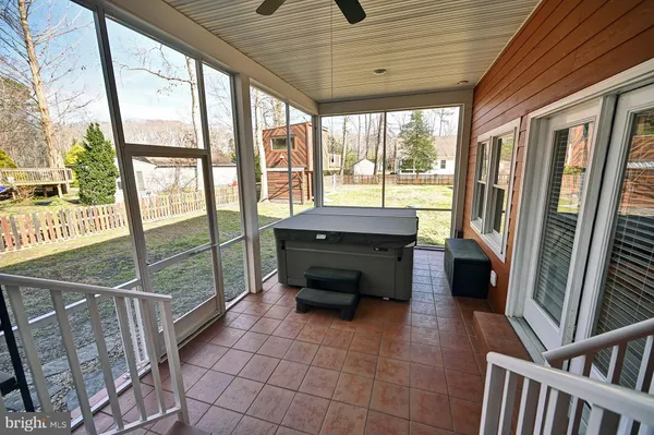 a view of a house with a yard porch and sitting area