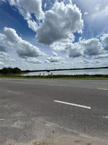 a view of a swimming pool and an outdoor seating