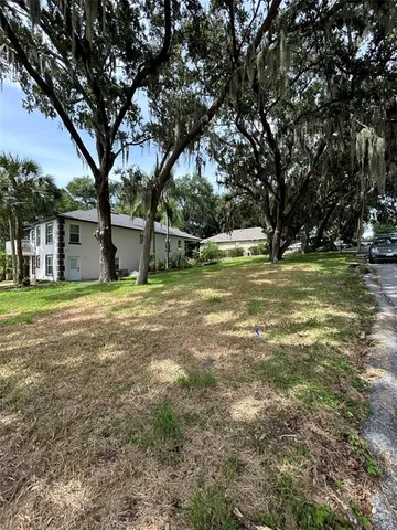 a view of pool with trees