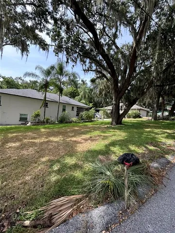 a view of a field with sitting area