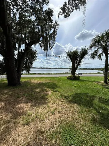a view of swimming pool with a yard