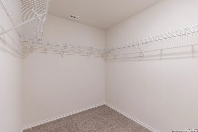 a view of a room with racks on the wall