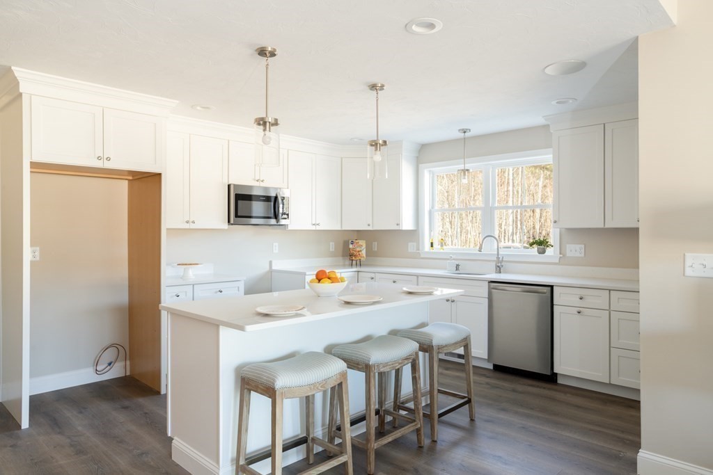 5 Katlyn Circle, Unit 9 Rochester, MA 02770 - Photo 11 of 17 a kitchen with a sink cabinets and window
