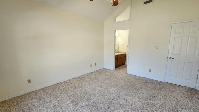 a view of an empty room and entryway