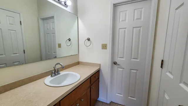 a bathroom with a toilet a sink and bathtub