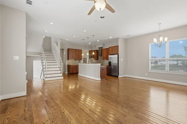 a view of entryway with wooden floor and door