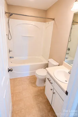 a bathroom with a sink a toilet and a bathtub