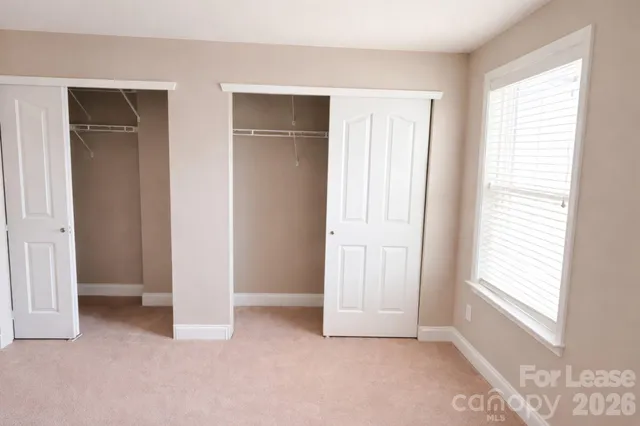 a view of an empty room with windows