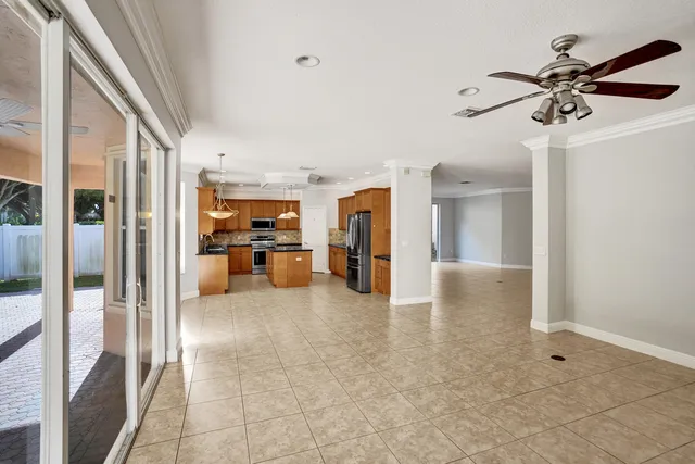 a view of a hallway view with living room and furniture