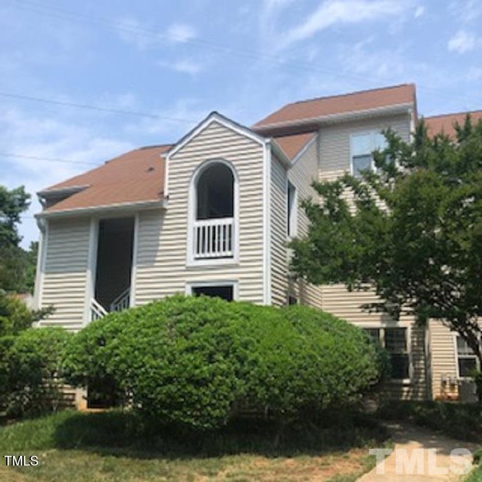 6020 Winterpointe Lane, Unit 103 Raleigh, NC 27606 - Photo 1 of 17 a front view of a house with a yard and garage