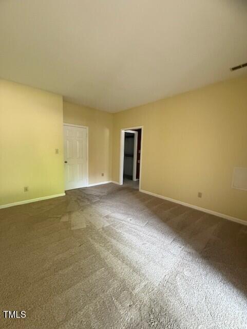 6020 Winterpointe Lane, Unit 103 Raleigh, NC 27606 - Photo 11 of 17 a view of an empty room and window