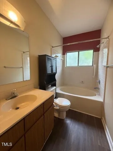 a bathroom with a sink a toilet and bathtub