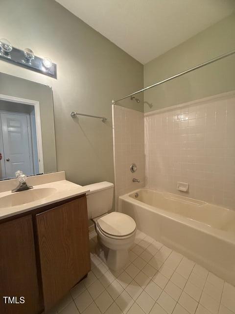 6020 Winterpointe Lane, Unit 103 Raleigh, NC 27606 - Photo 17 of 17 a bathroom with a sink a toilet a mirror and a shower