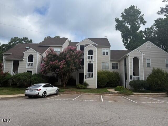 6020 Winterpointe Lane, Unit 103 Raleigh, NC 27606 - Photo 2 of 17 a car parked in front of white house