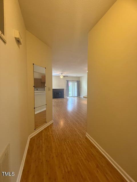 6020 Winterpointe Lane, Unit 103 Raleigh, NC 27606 - Photo 3 of 17 a view of empty room with wooden floor