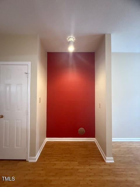 6020 Winterpointe Lane, Unit 103 Raleigh, NC 27606 - Photo 9 of 17 an empty room with wooden floor and windows