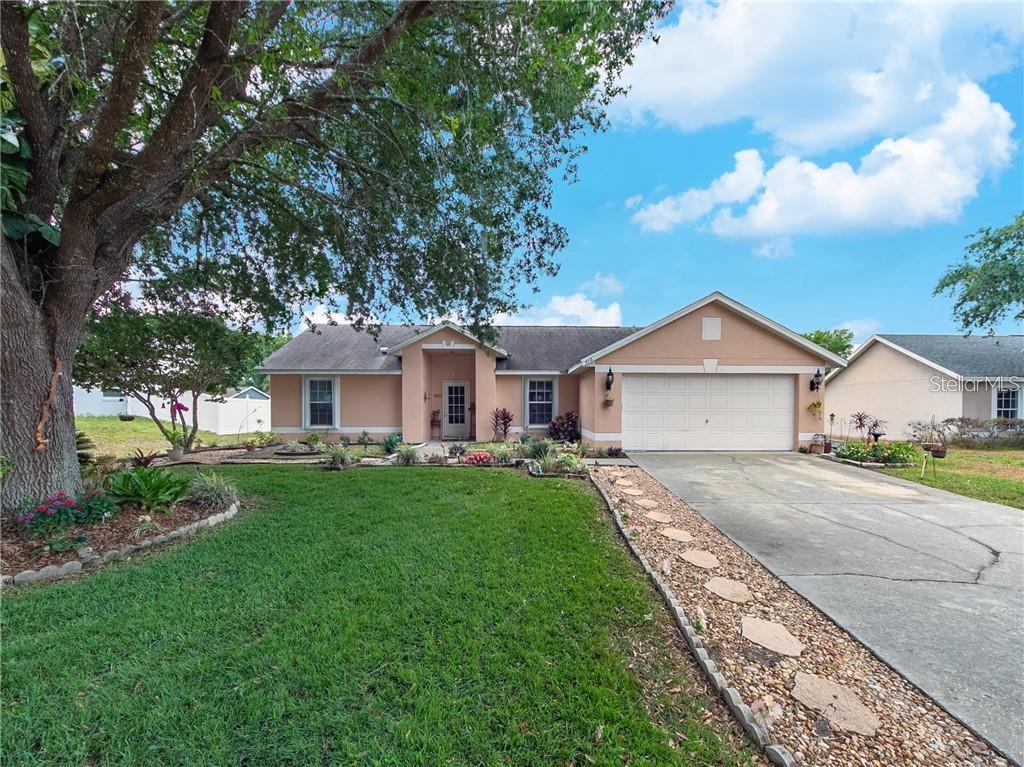 456 Nevada Loop Road Davenport, FL 33897 - Photo 1 of 1 a front view of a house with yard