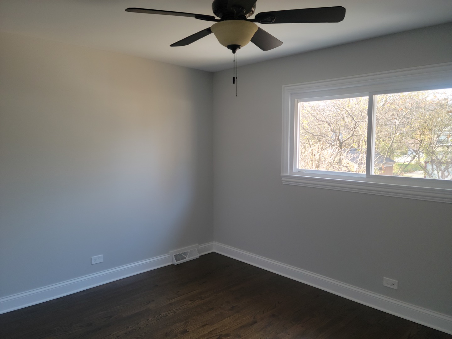 908 Long Road Glenview, IL 60025 - Photo 11 of 15 a view of an empty room with wooden floor and a window