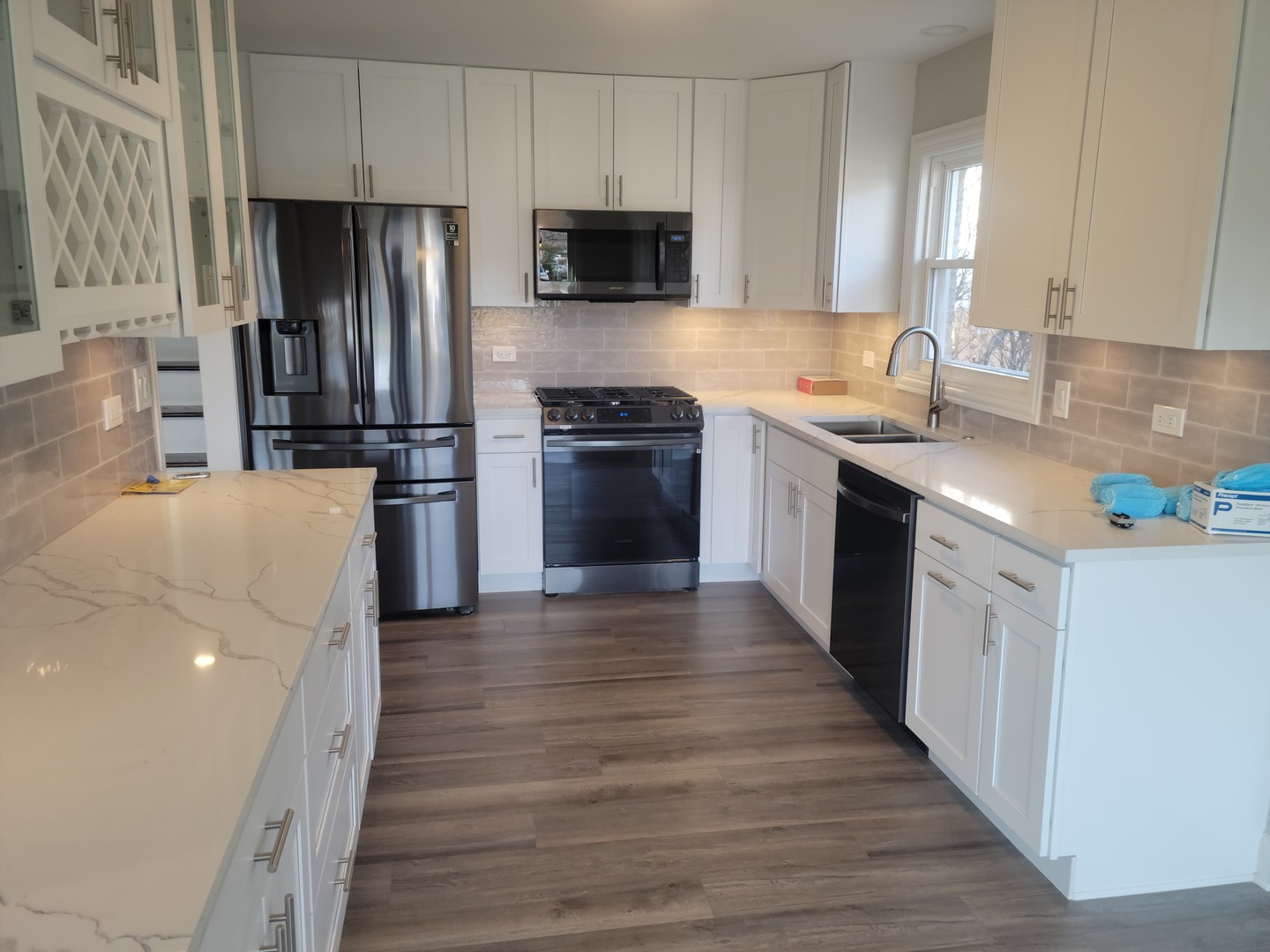 908 Long Road Glenview, IL 60025 - Photo 2 of 15 a kitchen with a refrigerator stove and wooden cabinets