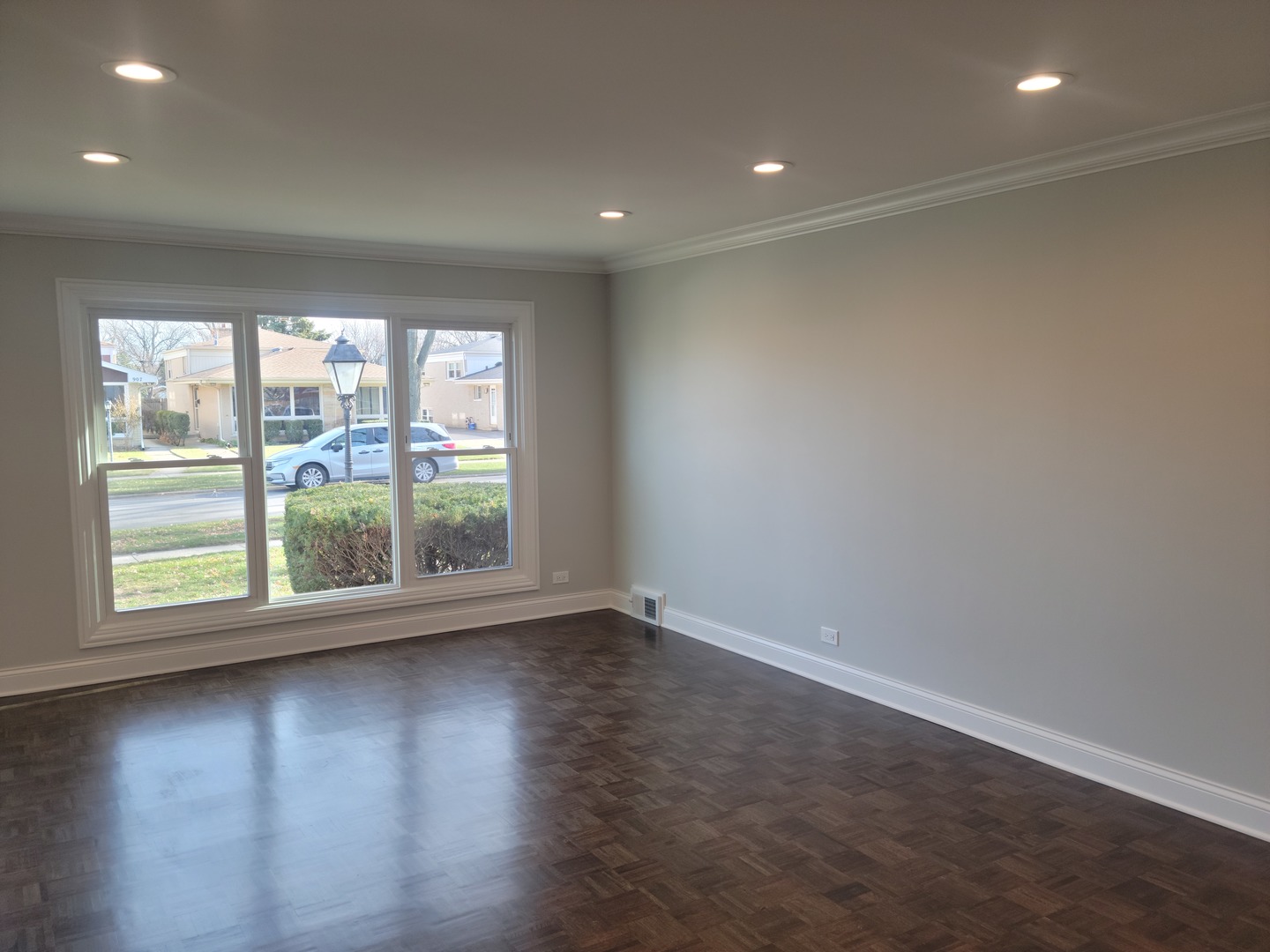 908 Long Road Glenview, IL 60025 - Photo 8 of 15 an empty room with wooden floor and windows