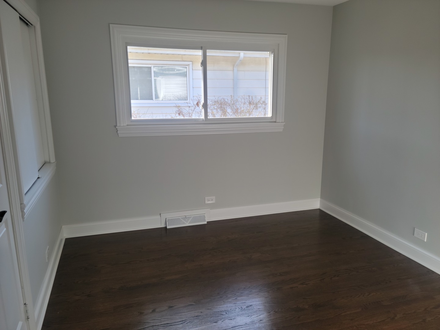 908 Long Road Glenview, IL 60025 - Photo 9 of 15 an empty room with wooden floor and windows