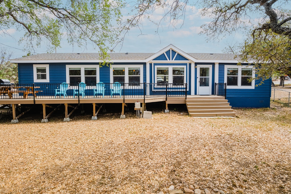 231 Wolf Run Burnet, TX 78611 - Photo 1 of 1 a front view of a house with garden