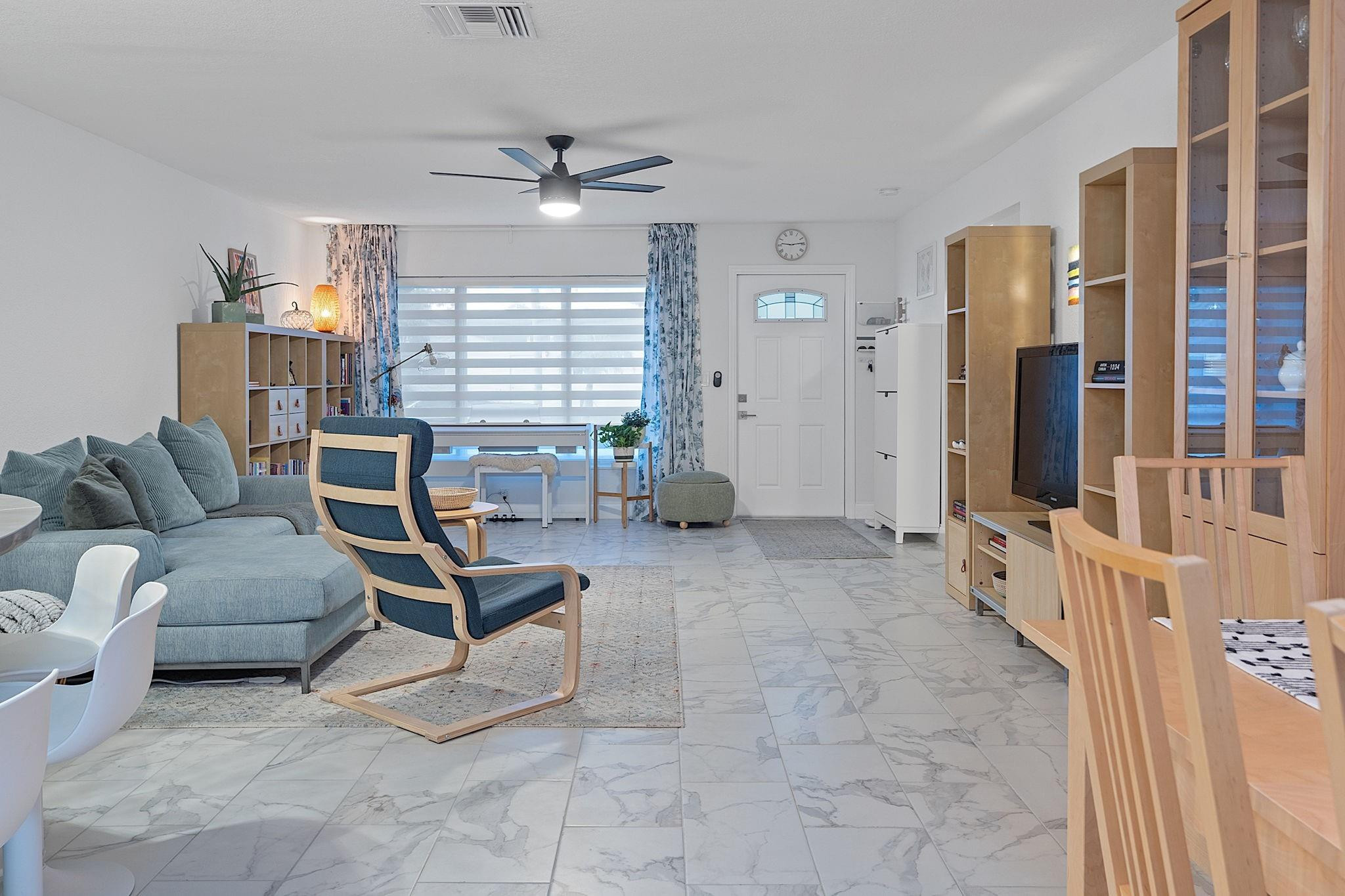 22848 Southwest 54th Way Boca Raton, FL 33433 - Photo 19 of 44 a living room with furniture and chandelier
