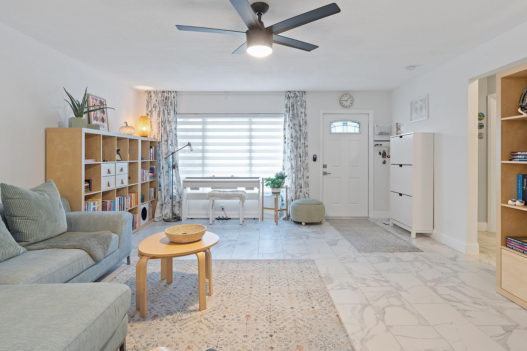 22848 Southwest 54th Way Boca Raton, FL 33433 - Photo 21 of 44 a living room with furniture and a large window