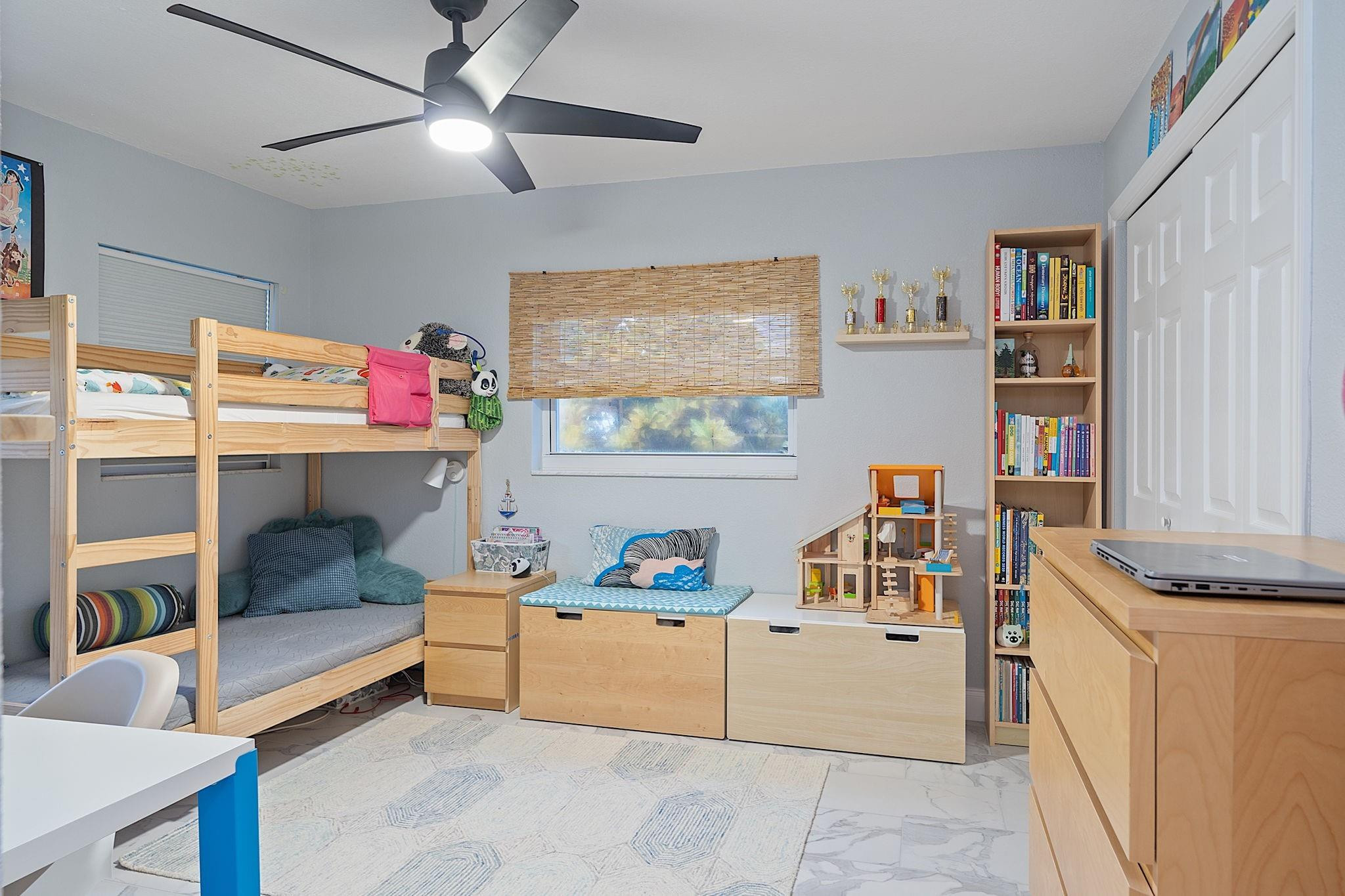 22848 Southwest 54th Way Boca Raton, FL 33433 - Photo 22 of 44 a bedroom with furniture and a window