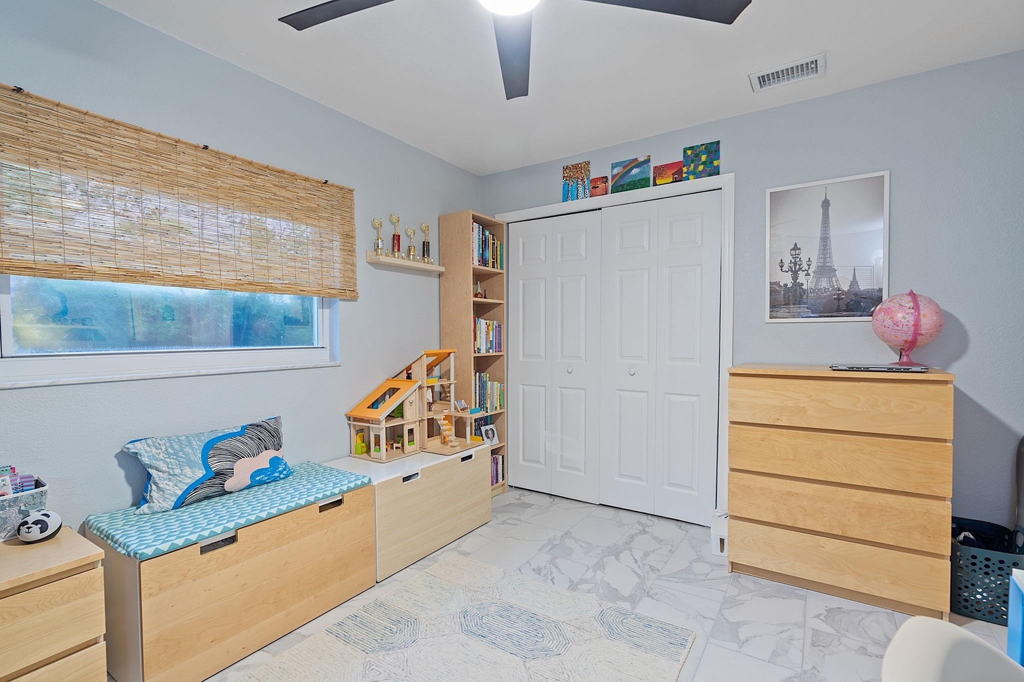 22848 Southwest 54th Way Boca Raton, FL 33433 - Photo 23 of 44 a bedroom with a bed and a window