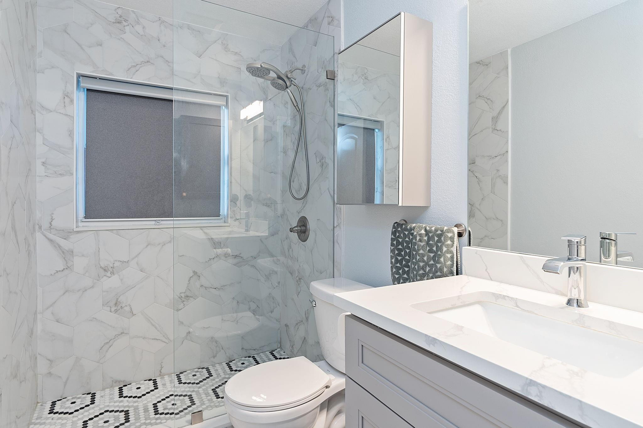 22848 Southwest 54th Way Boca Raton, FL 33433 - Photo 24 of 44 a bathroom with a sink a toilet and shower