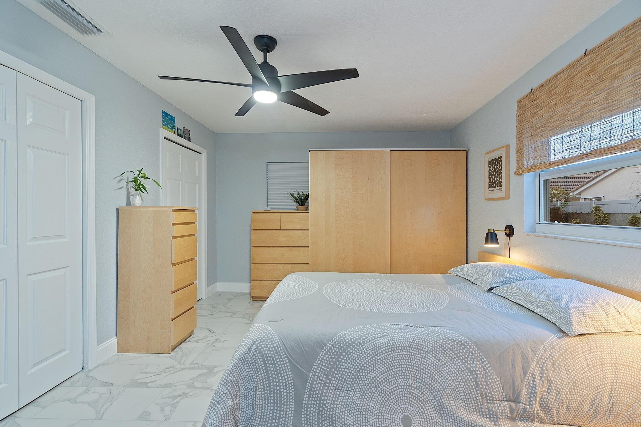 22848 Southwest 54th Way Boca Raton, FL 33433 - Photo 30 of 44 a bedroom with a bed and a mirror