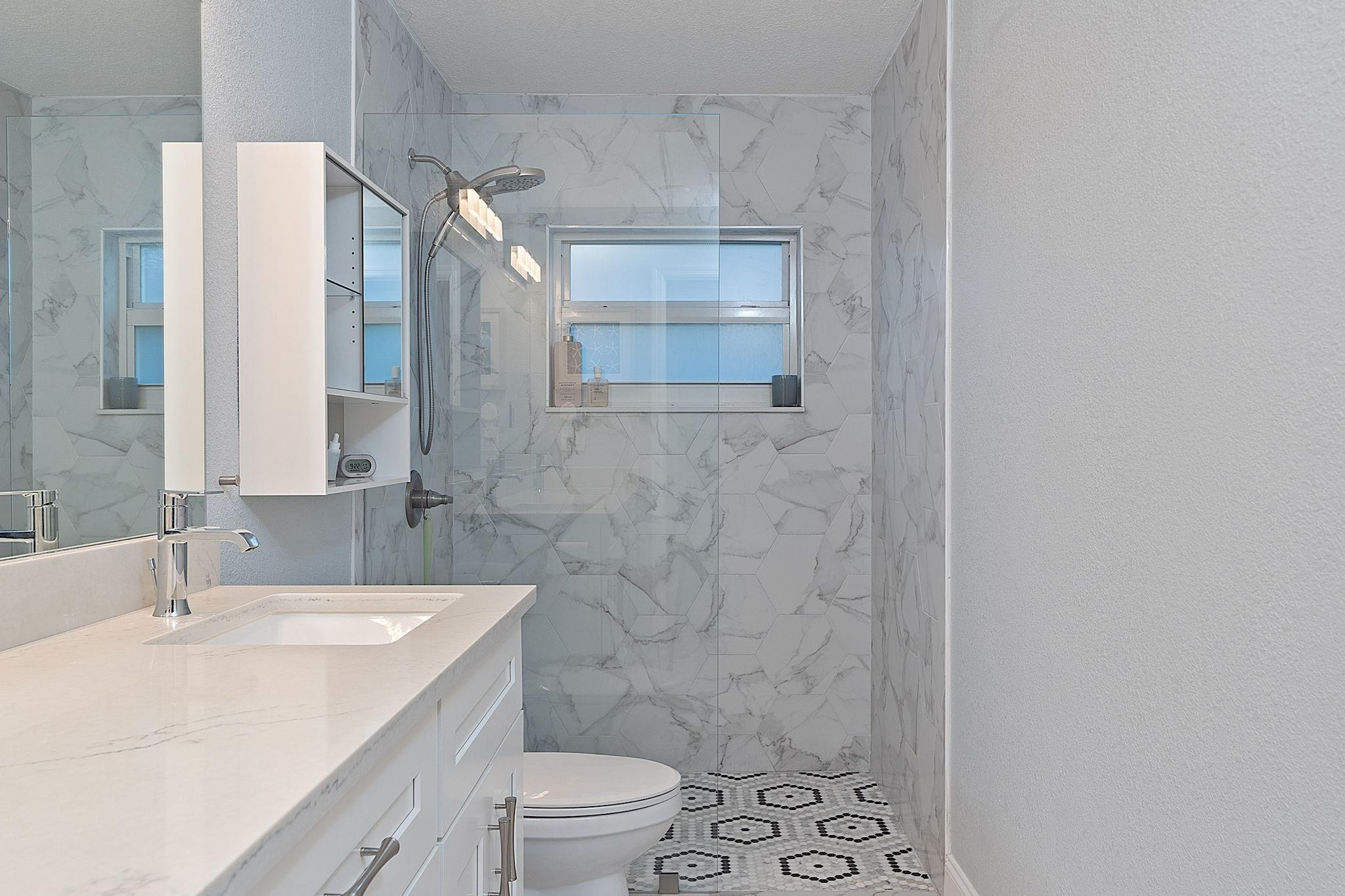 22848 Southwest 54th Way Boca Raton, FL 33433 - Photo 34 of 44 a bathroom with a sink a toilet and shower