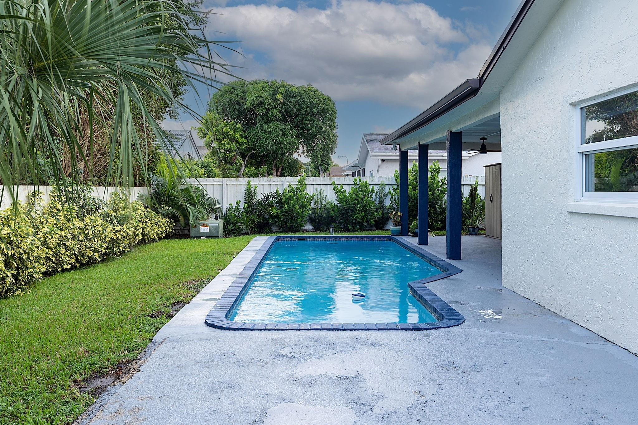 22848 Southwest 54th Way Boca Raton, FL 33433 - Photo 40 of 44 a view of a backyard with green space