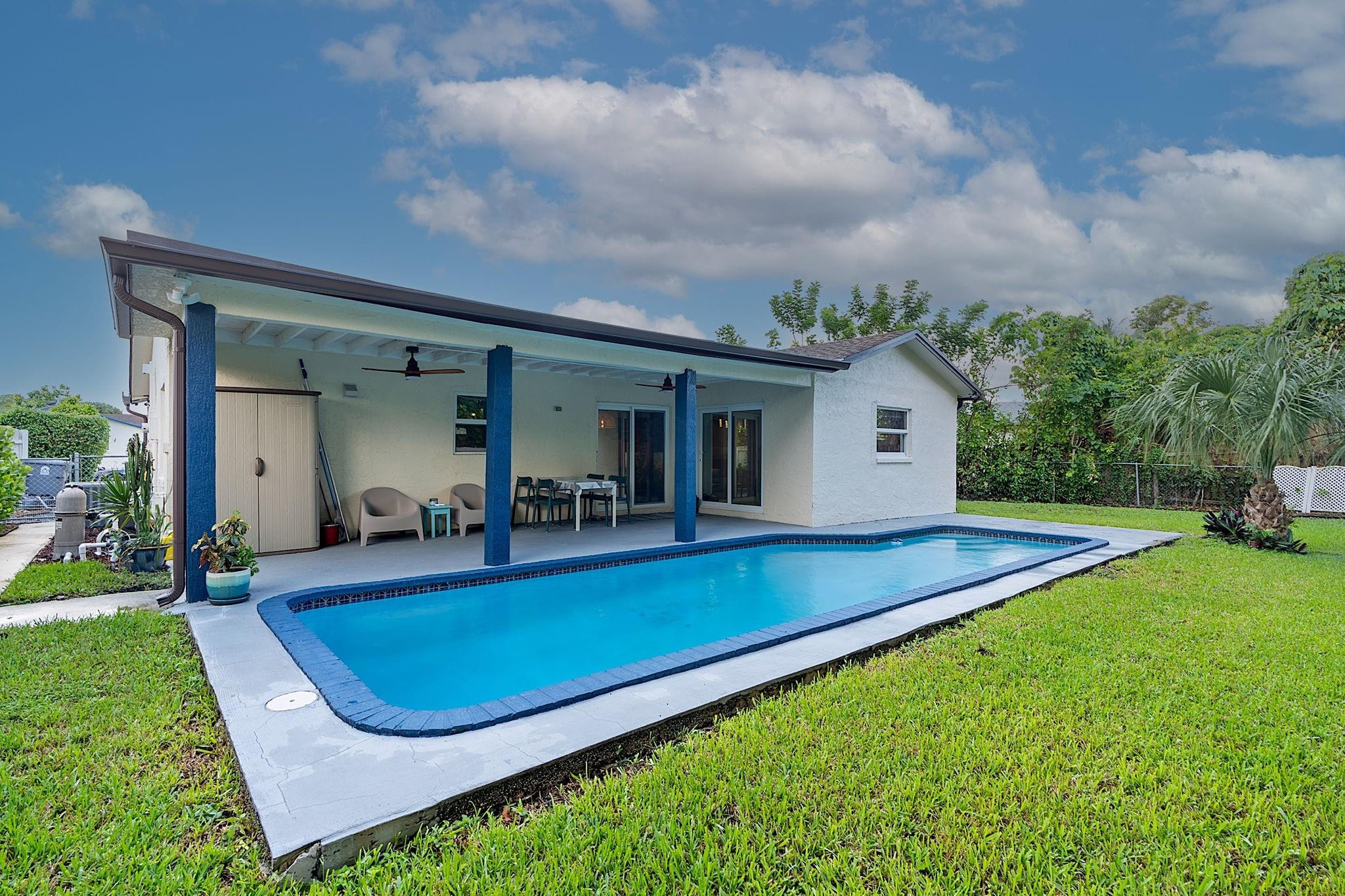 22848 Southwest 54th Way Boca Raton, FL 33433 - Photo 43 of 44 swimming pool view with a outdoor seating
