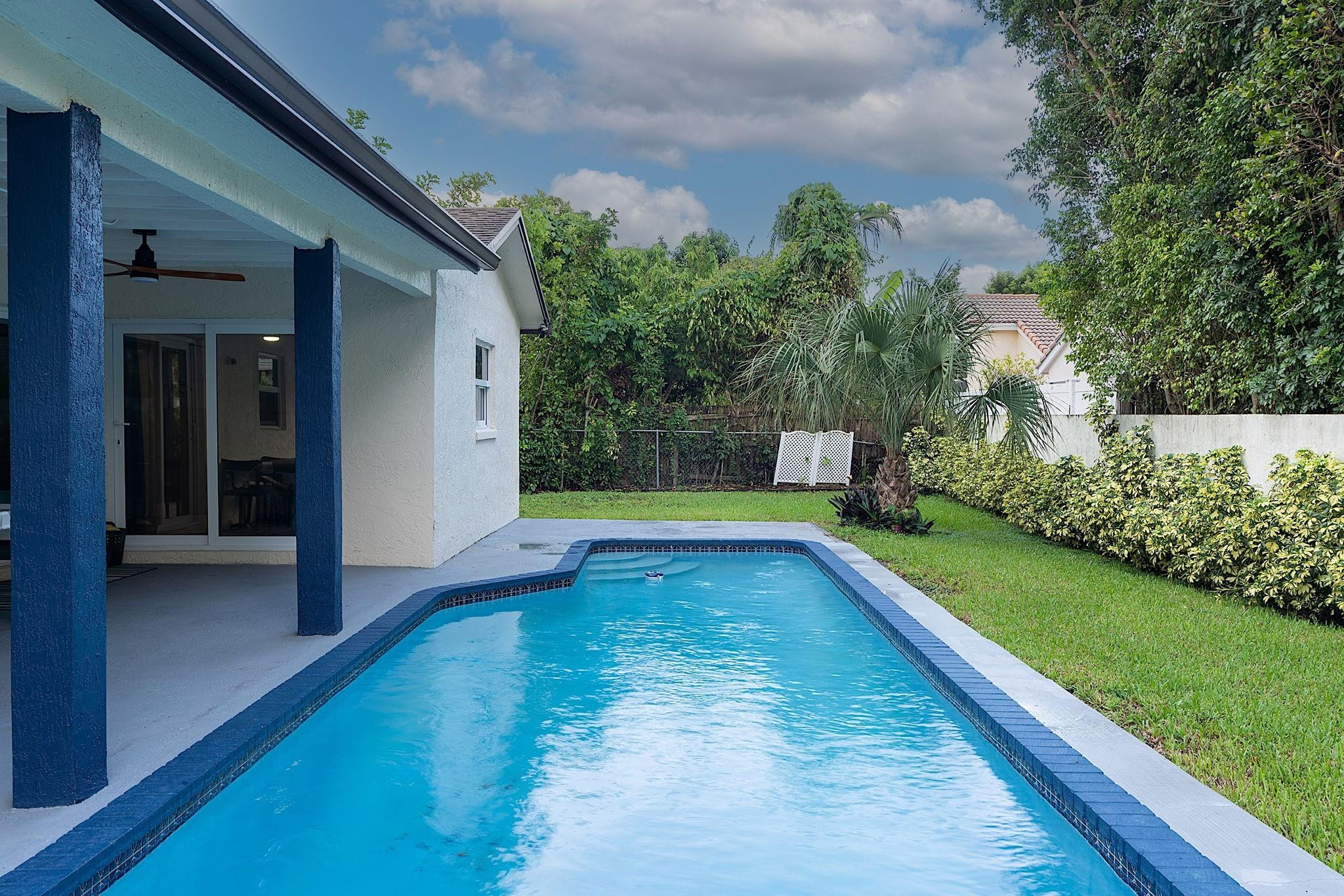 22848 Southwest 54th Way Boca Raton, FL 33433 - Photo 44 of 44 a view of a swimming pool with a yard