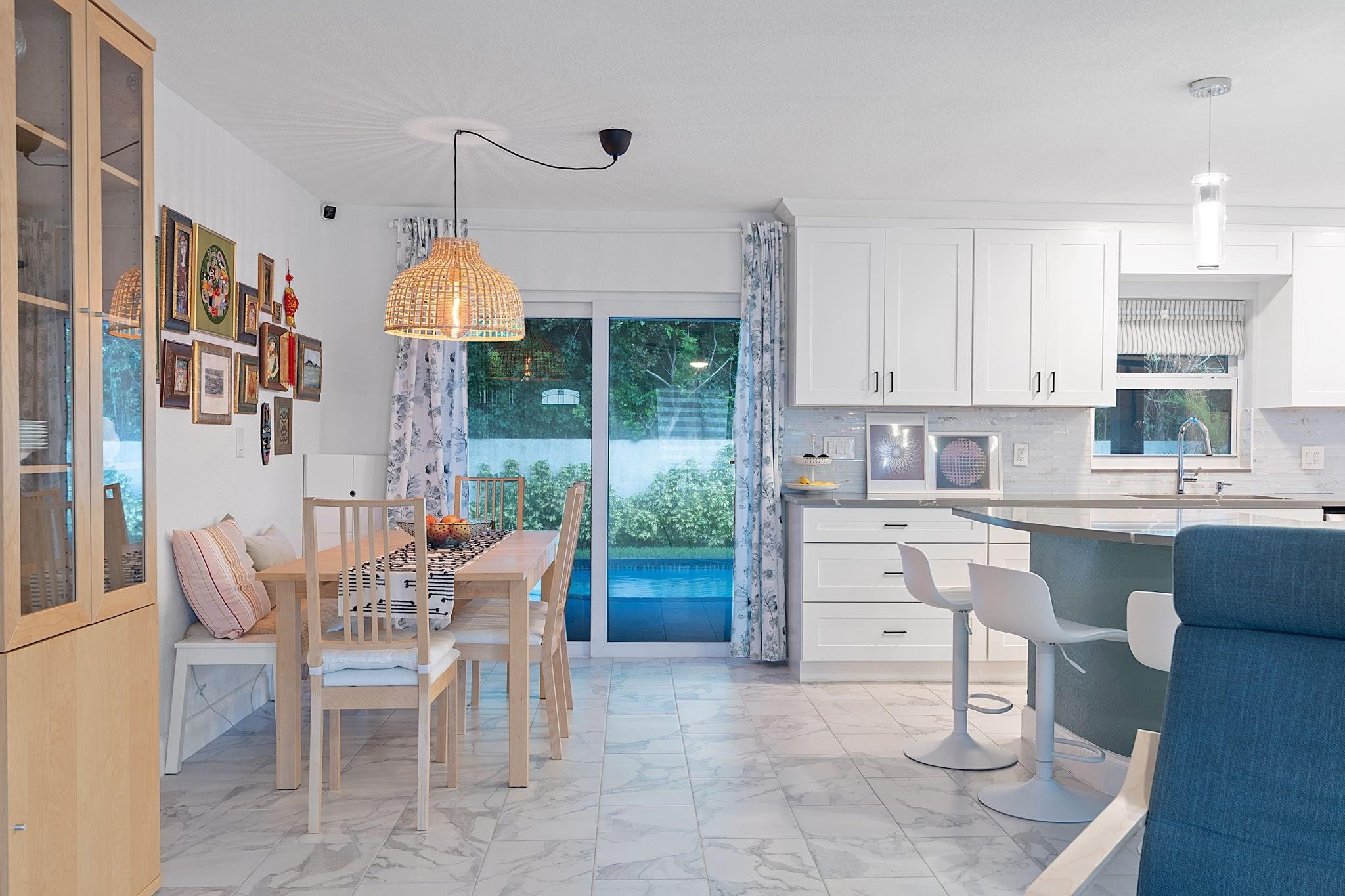 22848 Southwest 54th Way Boca Raton, FL 33433 - Photo 9 of 44 a kitchen that has a lot of cabinets in it and appliances