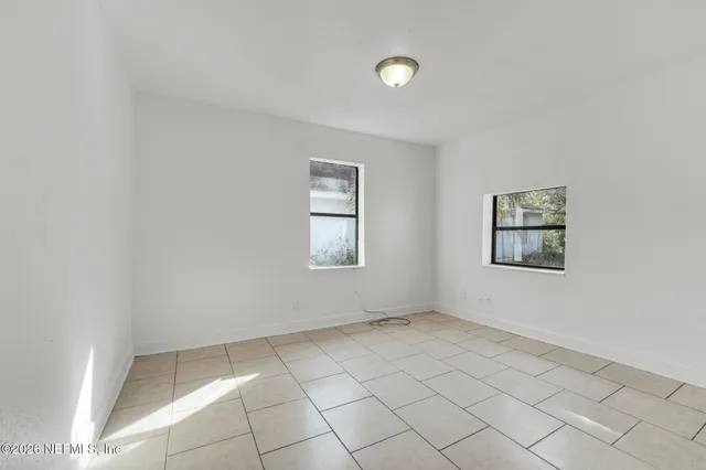 an empty room with windows