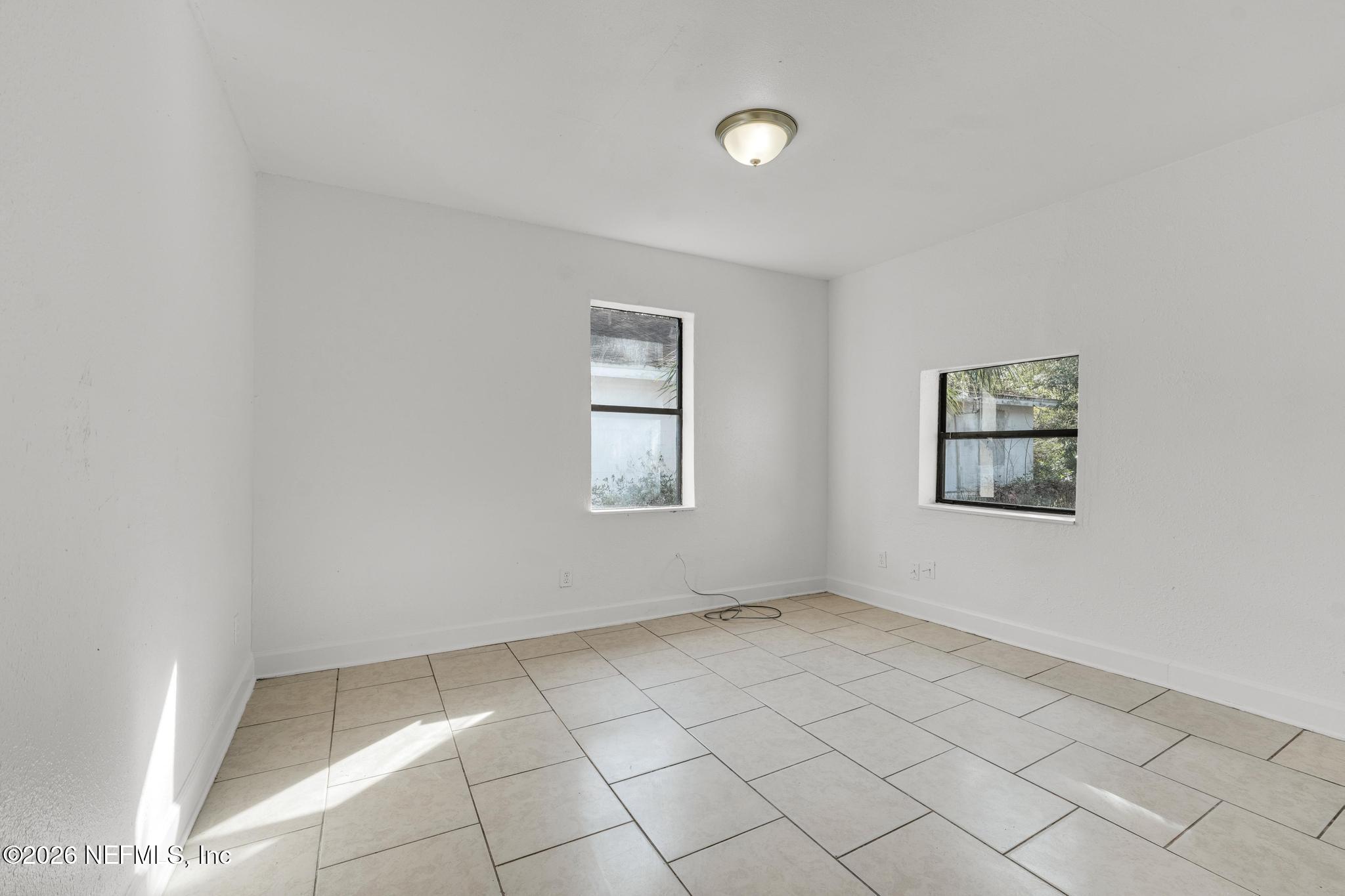 1830 West 27th Street Jacksonville, FL 32209 - Photo 12 of 21 an empty room with windows