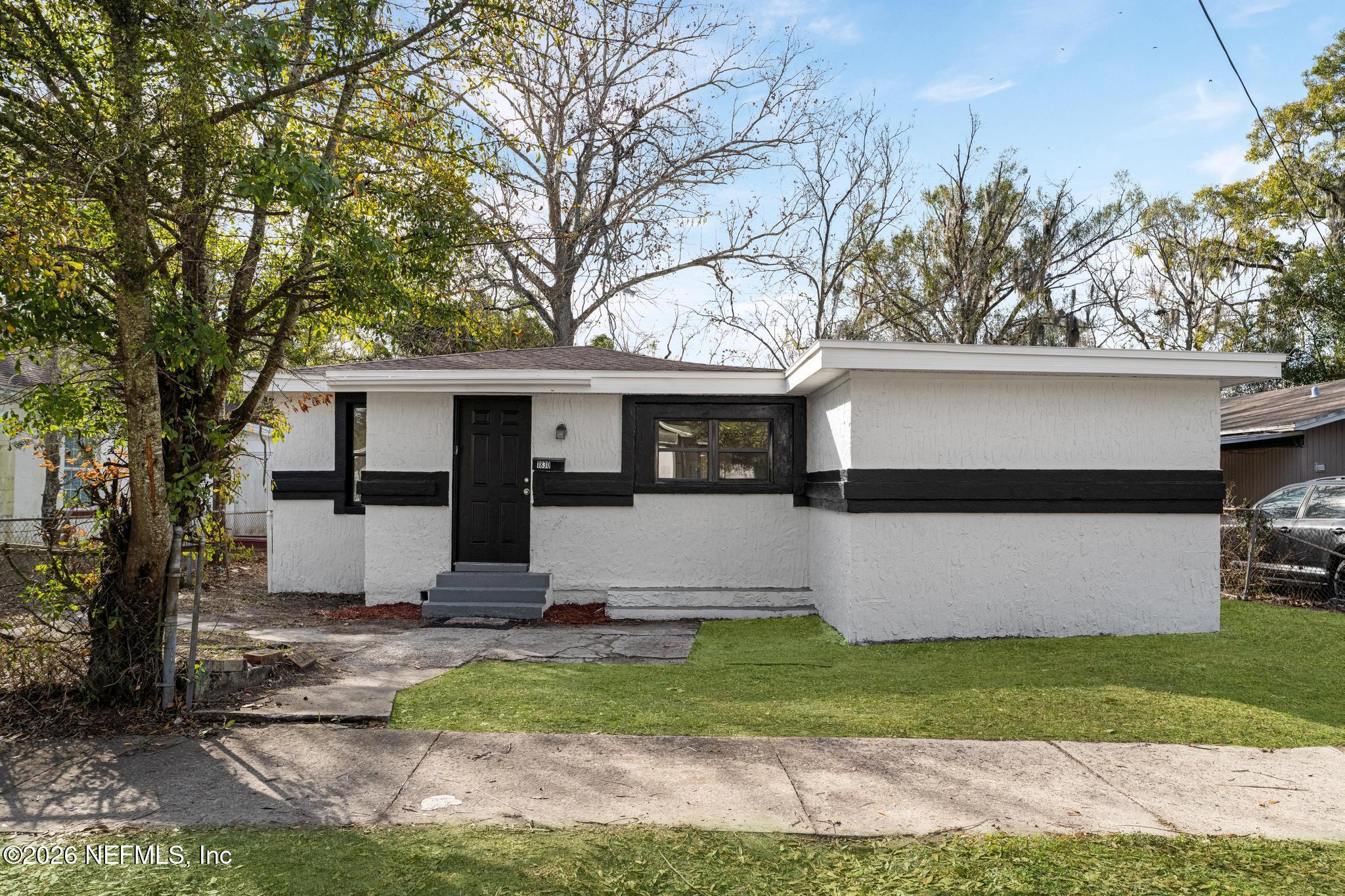1830 West 27th Street Jacksonville, FL 32209 - Photo 2 of 21 a front view of house with a garden