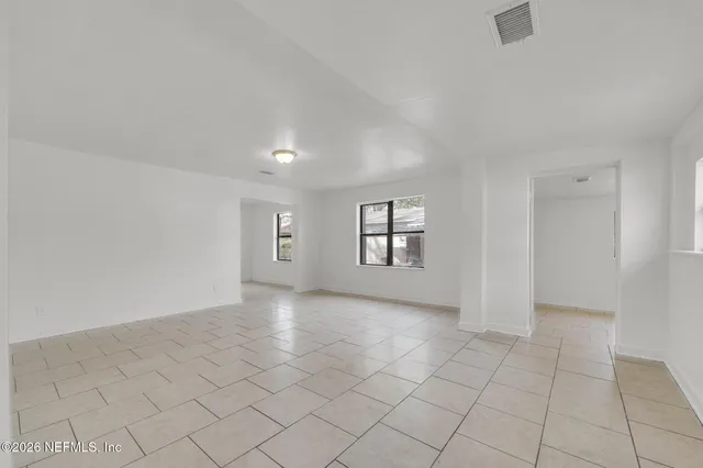 an empty room with windows