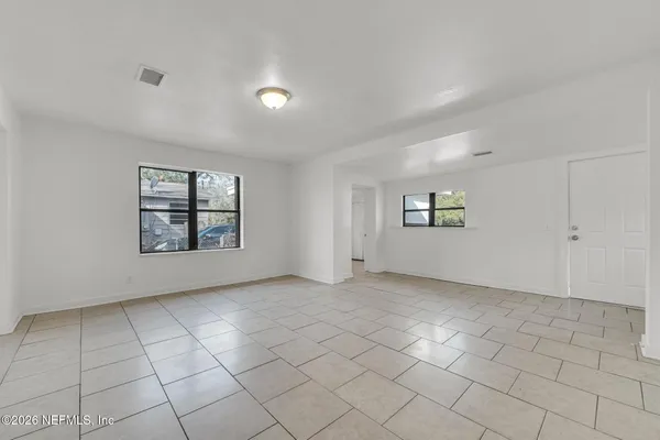 an empty room with windows