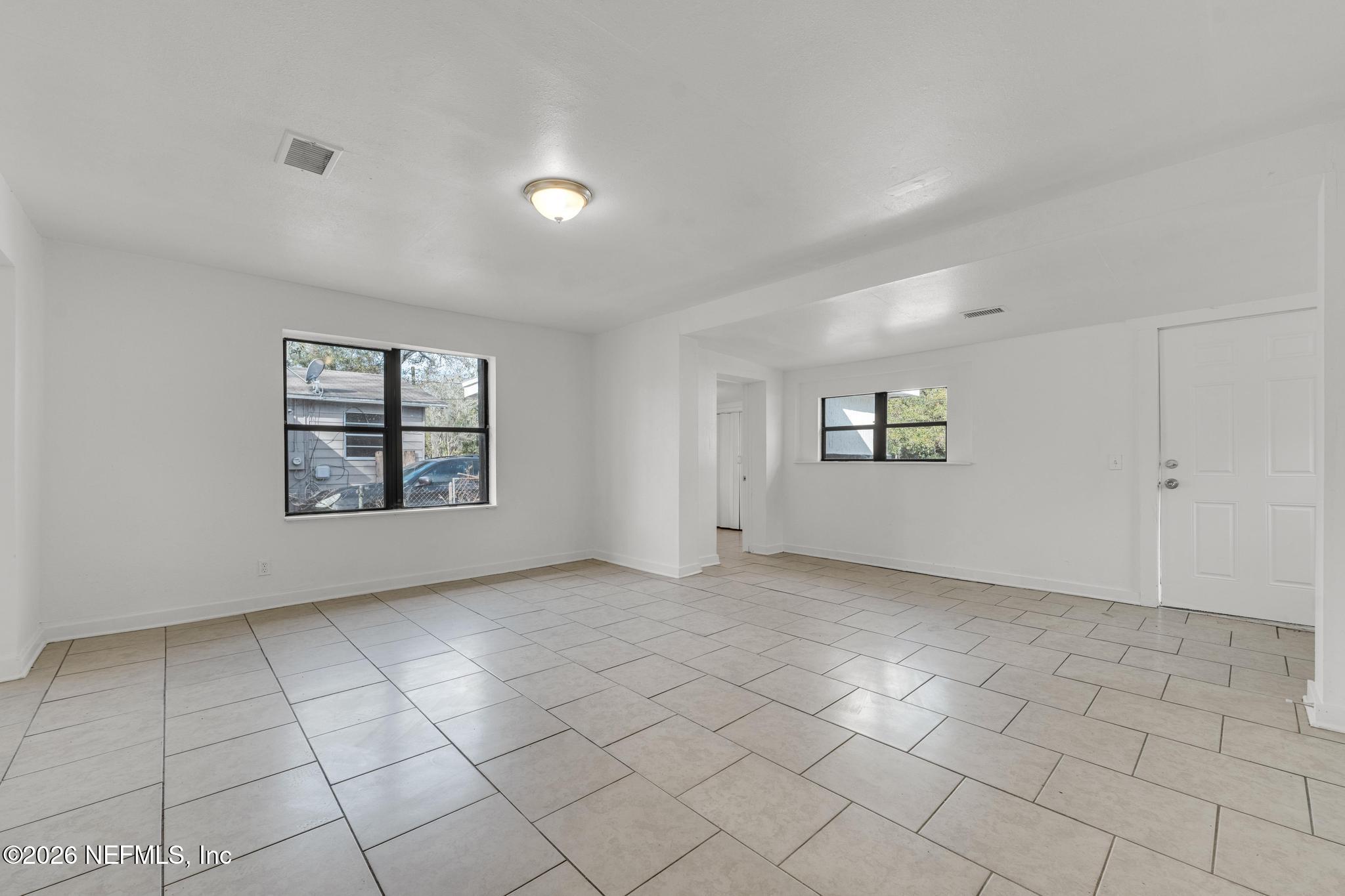 1830 West 27th Street Jacksonville, FL 32209 - Photo 7 of 21 an empty room with windows