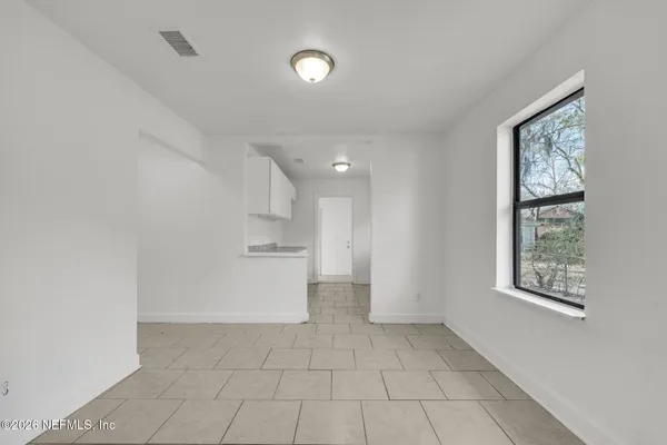 a view of kitchen and windows