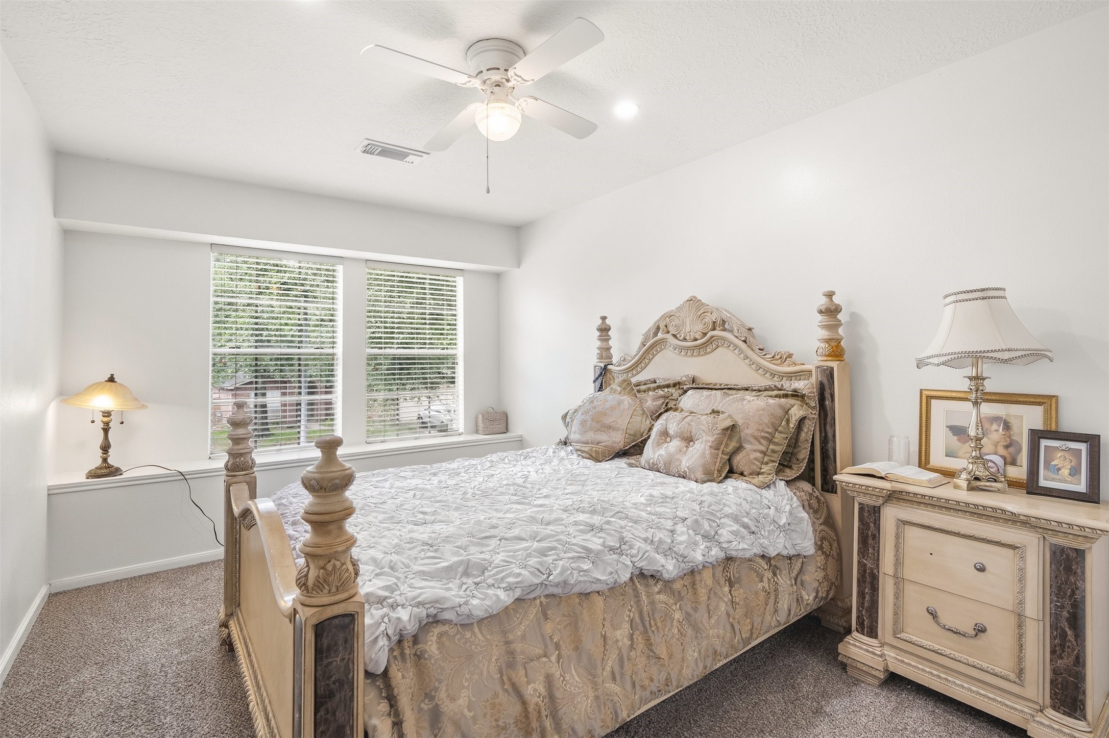 28723 Sedgefield Street Spring, TX 77386 - Photo 15 of 20 a bedroom with a large bed and a chandelier