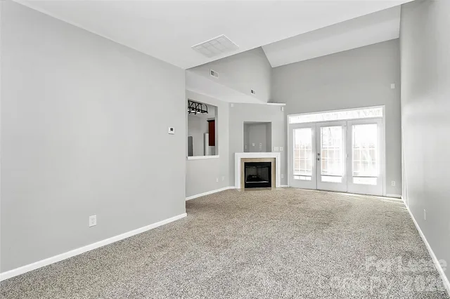 an empty room with fireplace