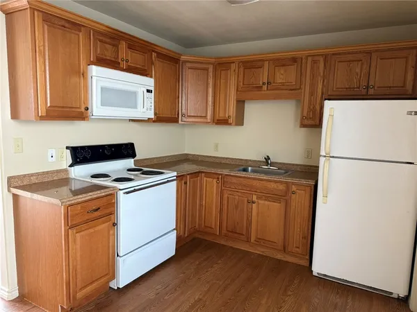 a kitchen with a refrigerator stove and microwave