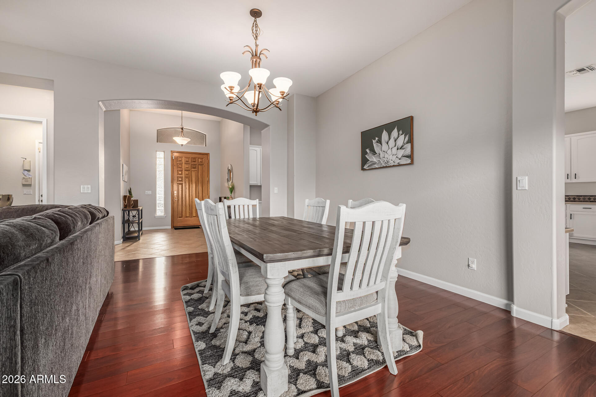 13318 West Coronado Road Goodyear, AZ 85395 - Photo 12 of 48 a view of a dining room with furniture and wooden floor