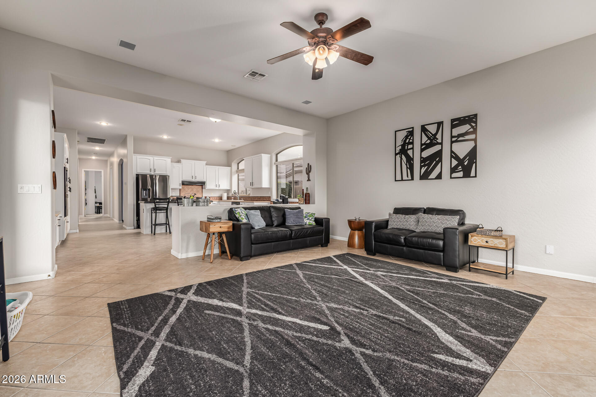 13318 West Coronado Road Goodyear, AZ 85395 - Photo 14 of 48 a living room with furniture a table and chairs